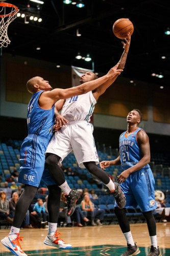 Reno Bighorn RA'SHAD JAMES (10) soars to the basket and draws the foul against Oklahoma City Blue RODNEY WILLIAMS (34) during the NBA D-League Basketball game between the Reno Bighorns and the Oklahoma City Blue at the Reno Events Center in Reno, Nevada.