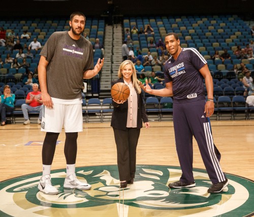 Reno Mayor Hillary Schieve has a ceremonial tip off with Reno Bighorn Center SIM BHULLAR (44) and Texas Legends Forward RON ANDERSON (34)
